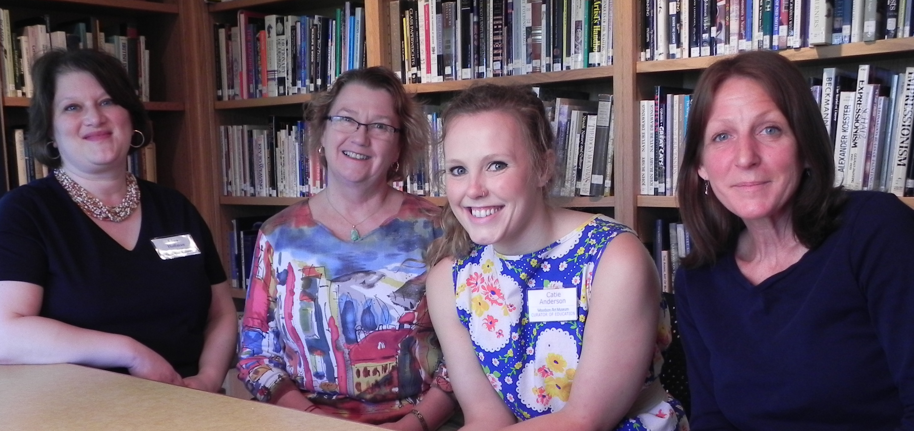 Two docents pose with two Museum staff members during training on June 4, 2014.