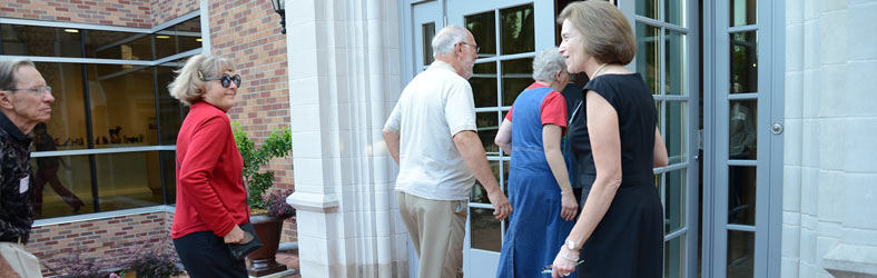 Kathy Kelsey Foley greeting guests during a 2013 Birds in Art preview reception