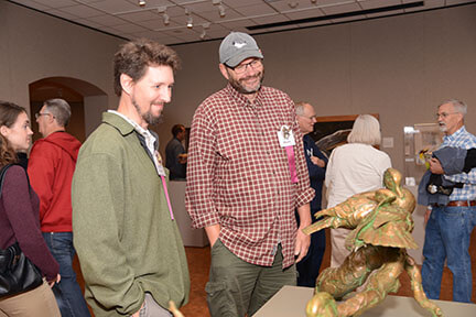 Sean Murtha (left) and former museum professional Paul Rhymer (right) discussing Paul's work at the public opening of Birds in Art. 