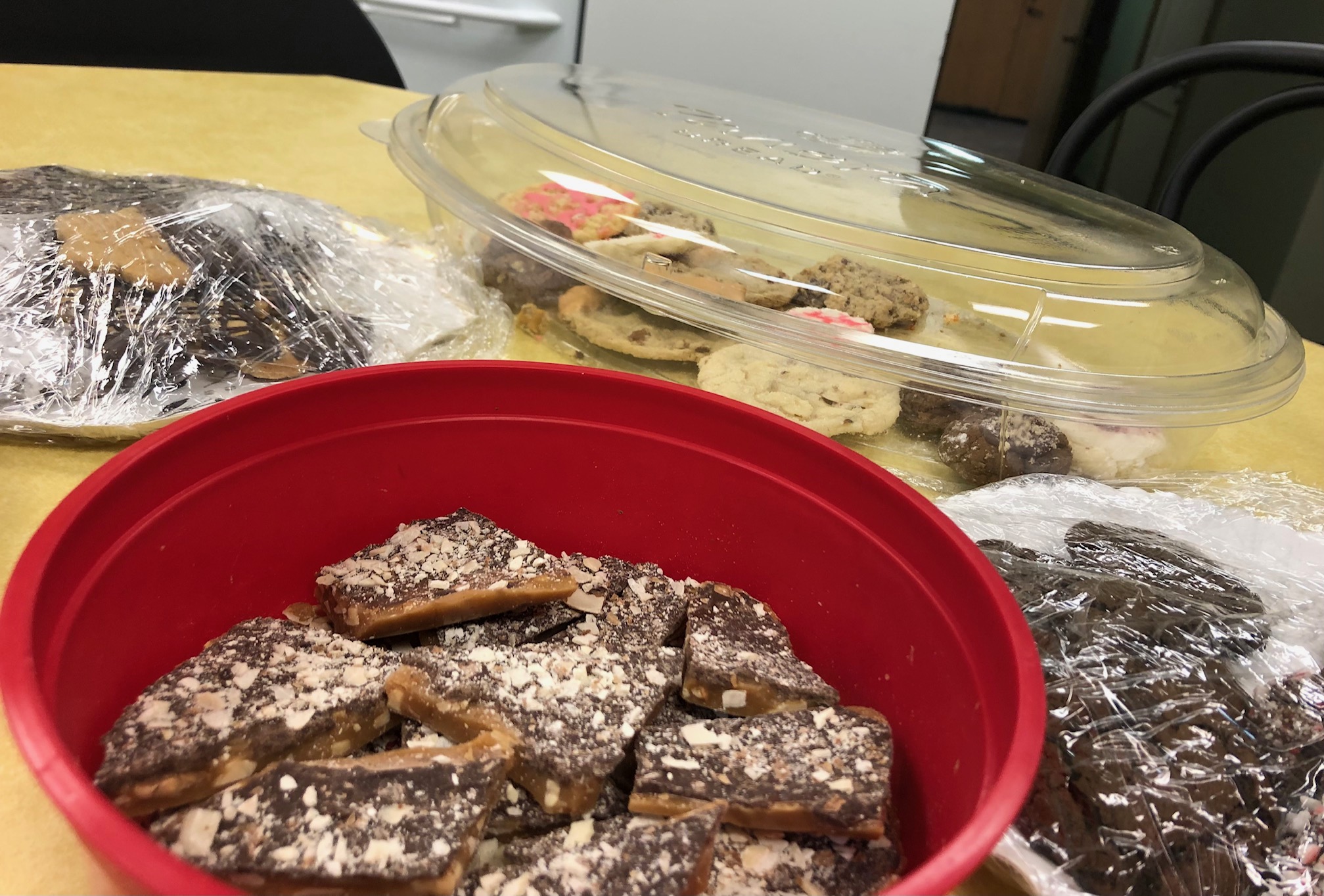 This image shows several plates of cookies and toffee