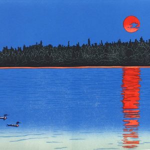 Two loons slide on a blue lake's surface where a red sun is reflected in the water. Dark tree silhouettes line the shore beneath a darkening blue twilight sky.