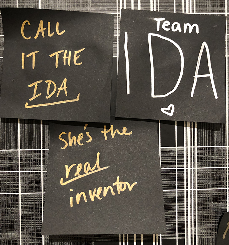 Three visitors' notes stating "Call it the Ida," "Team IDA," and "She's the real inventor"