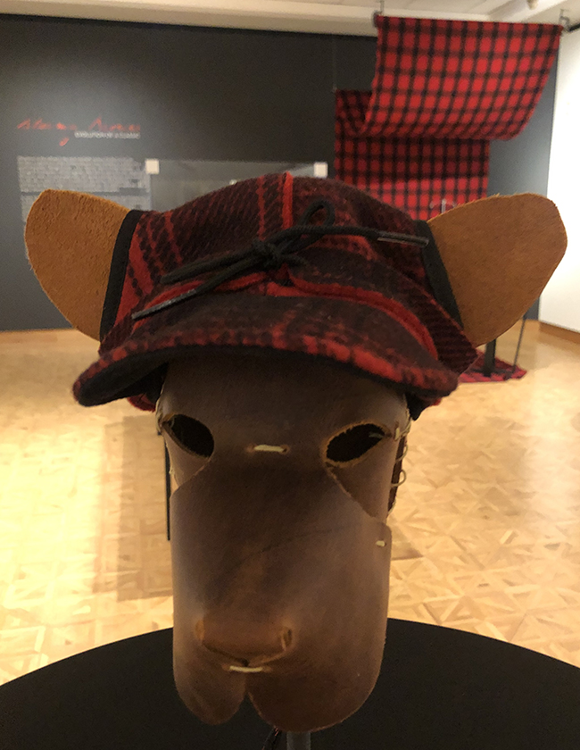 A Critter Kromer cap perches atop a leather model of a dog's head