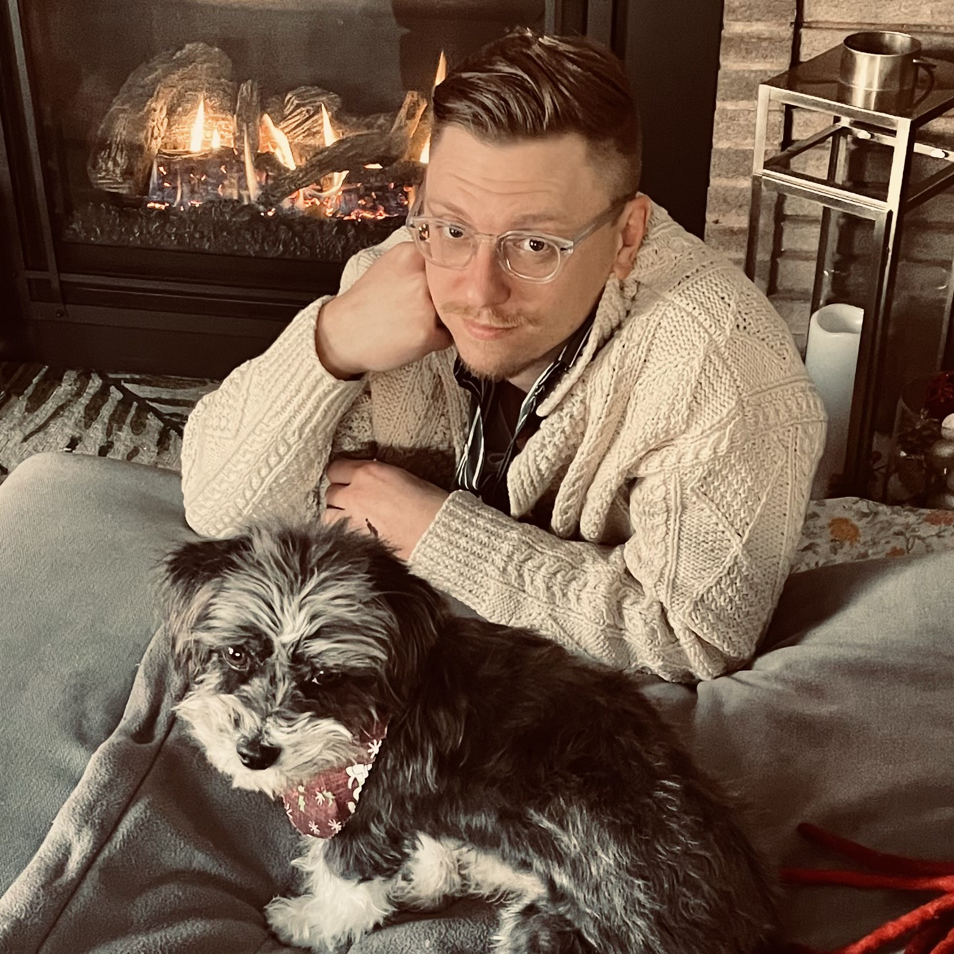 Photo of blog post author sitting with his dog