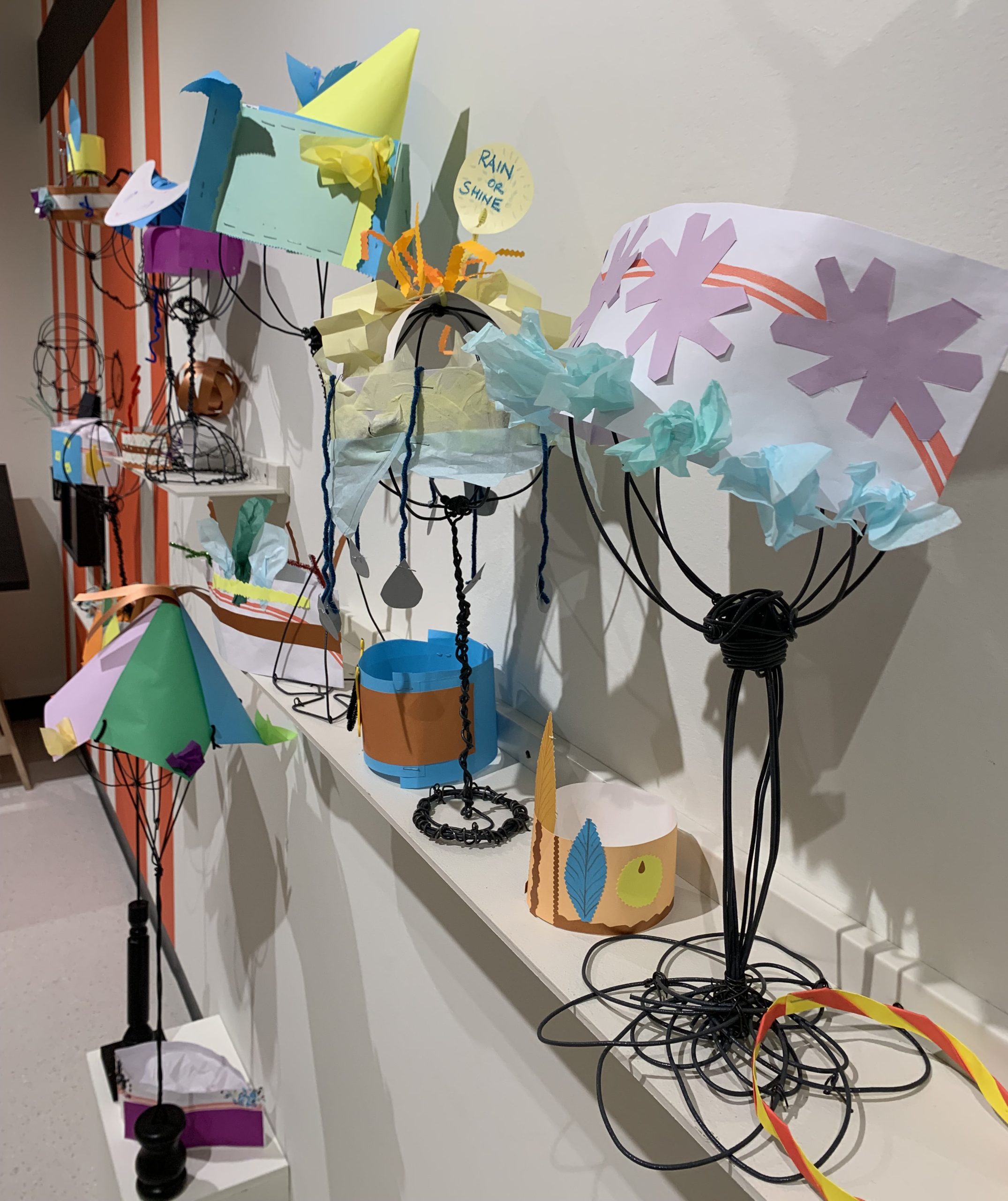 Examples of hats made in the Museum's interactive gallery art park