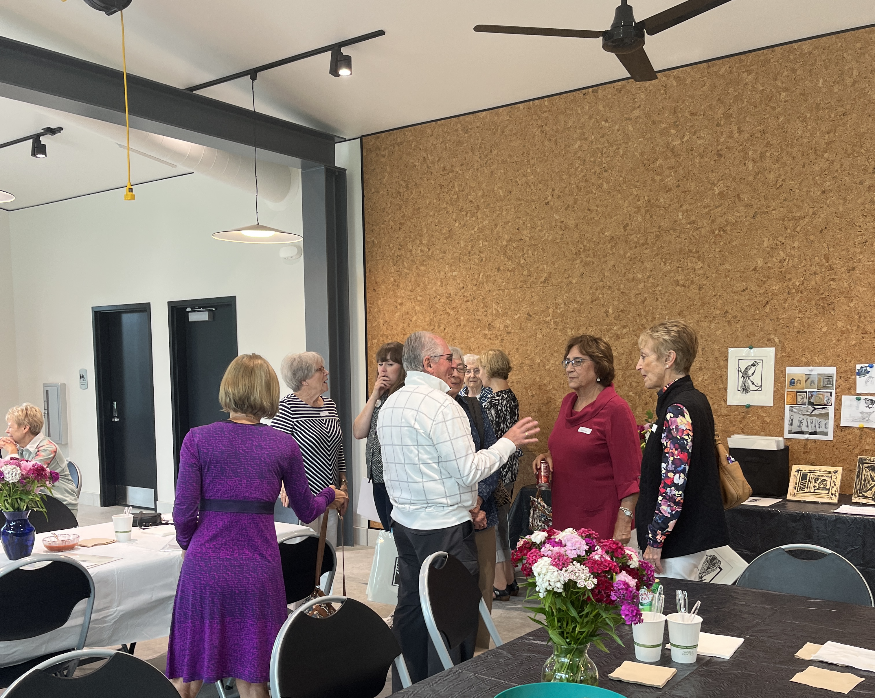 Docents and staff mingle in the Glass Box Studio