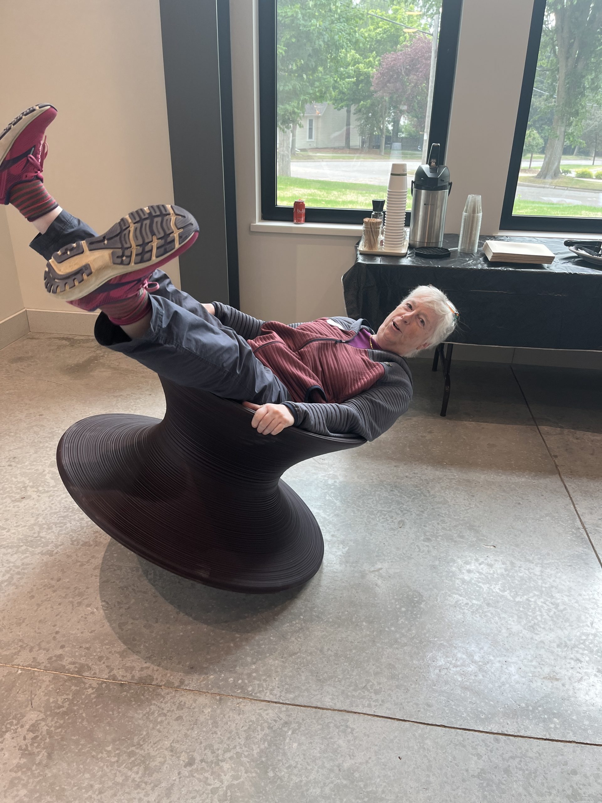 Maggie tests out new chair in the Glass Box Studio