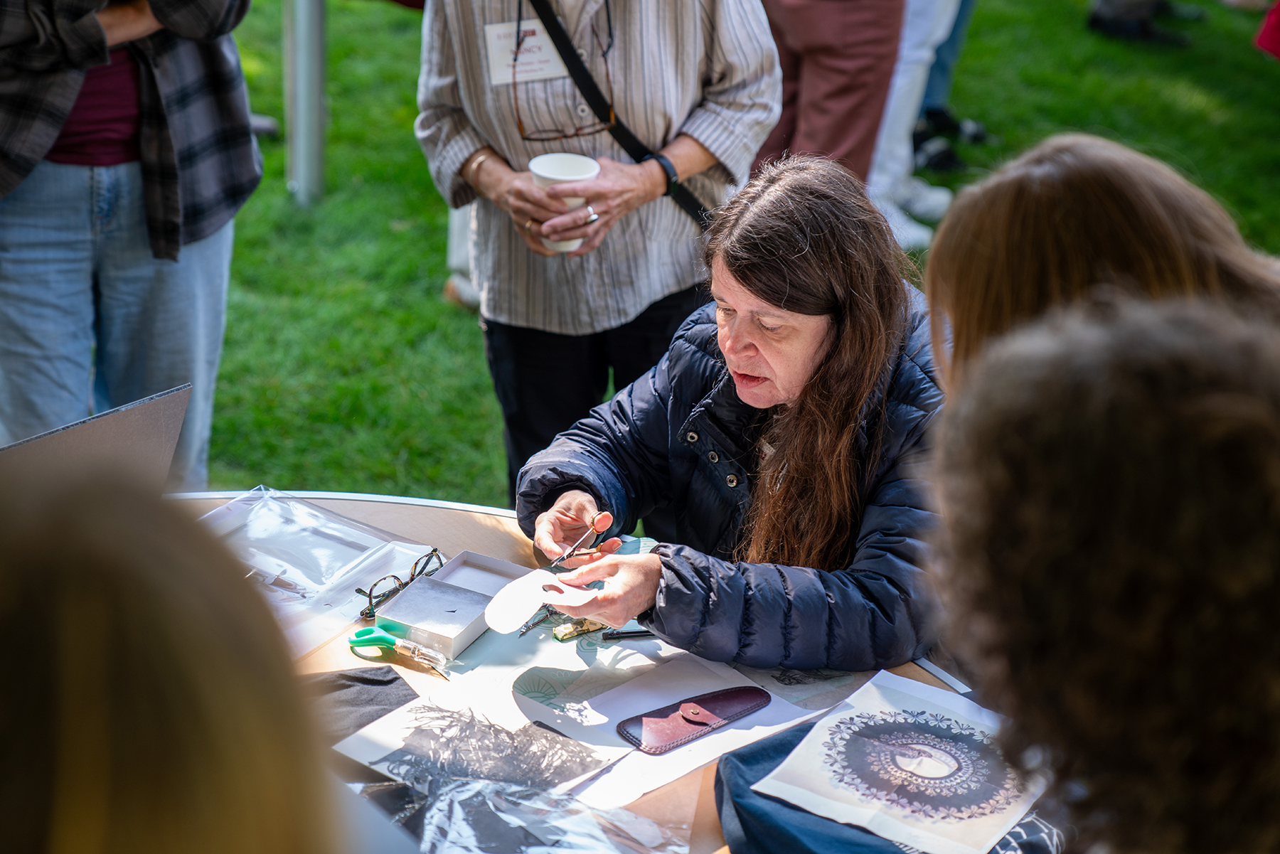 Lucrezia Bieler presents her paper cutting talents at Saturday's Artists in Action