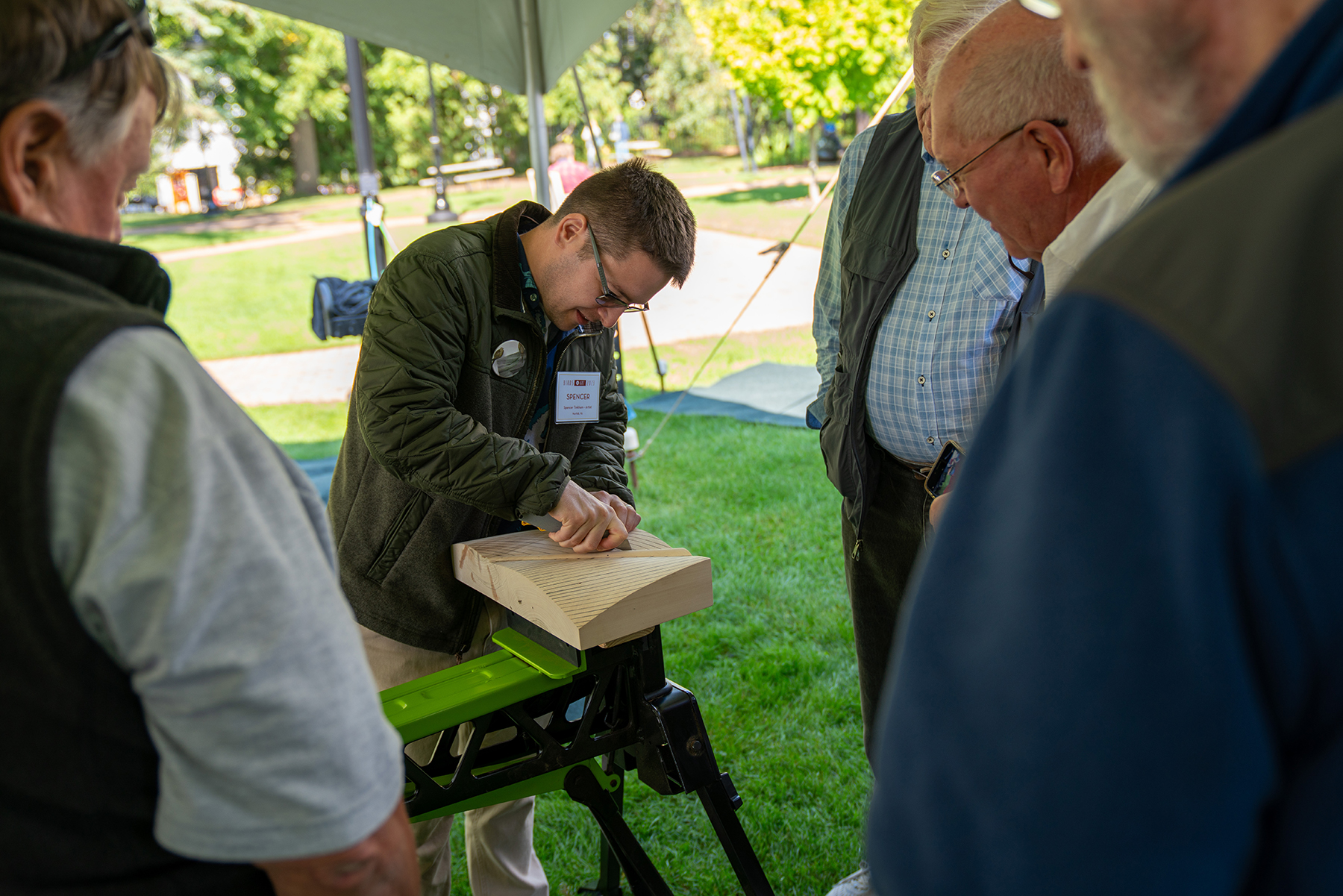 Spencer Tinkham shows off his carving skills during a Members Preview Artist in Action