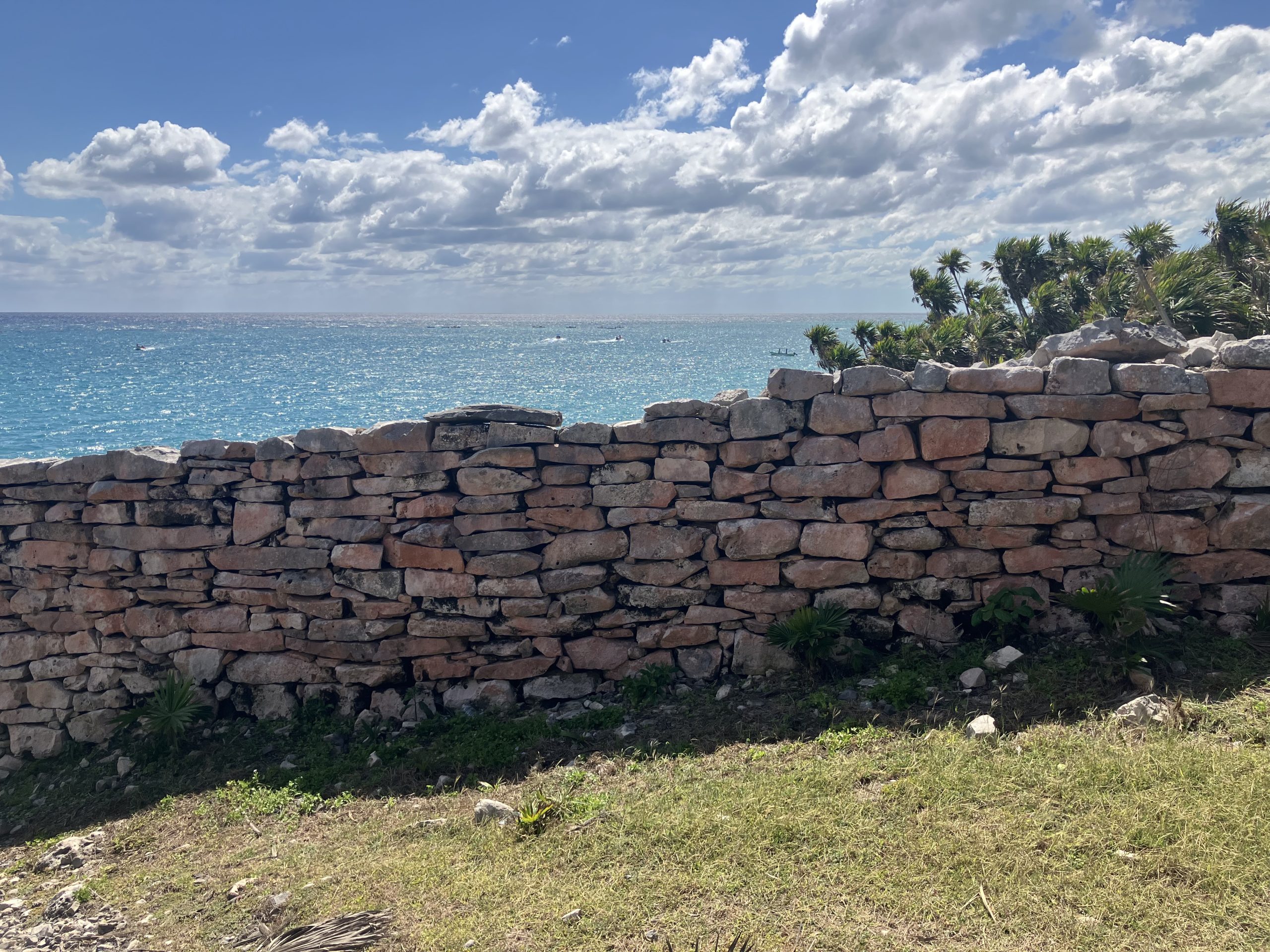 Part of the wall enclosing Tulum, looking over the Caribbean SeaEvidence of the blue and red paint that once covered the wall can still be seen on the limestone.