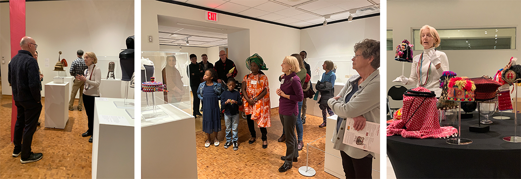 Stacey Miller giving a tour of the galleries and showing some of the hats in her collection