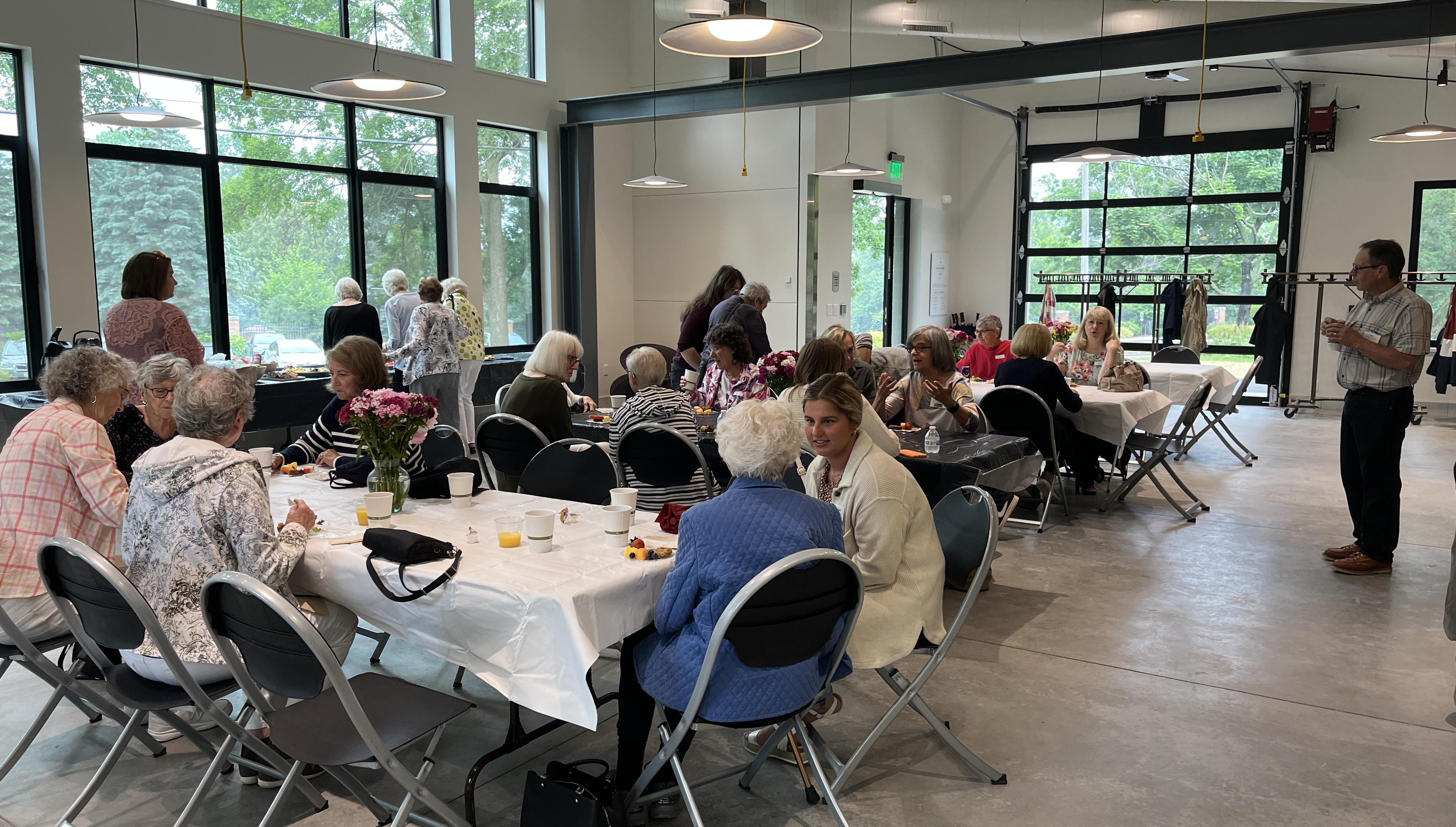 Greeters and staff mingle in the Glass Box Studio