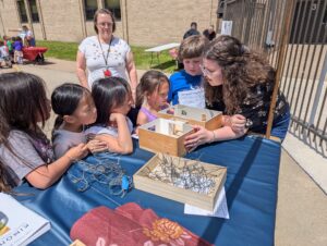 Emily working with students outside at the event.
