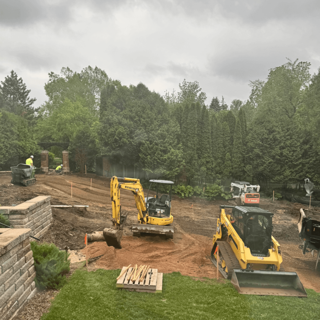 image of the construction workers digging up the lower garden.