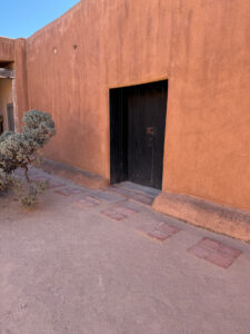 Outside Georgia O'Keeffe's house in New Mexico.